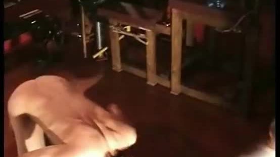 Dirty slave lying on the floor gets kicked in his balls by horny mistress bdsm